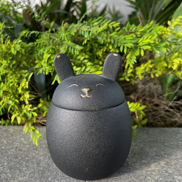 Black coloured bunny shaped pet urn