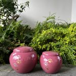 Pink coloured Pet urn with gold paw prints